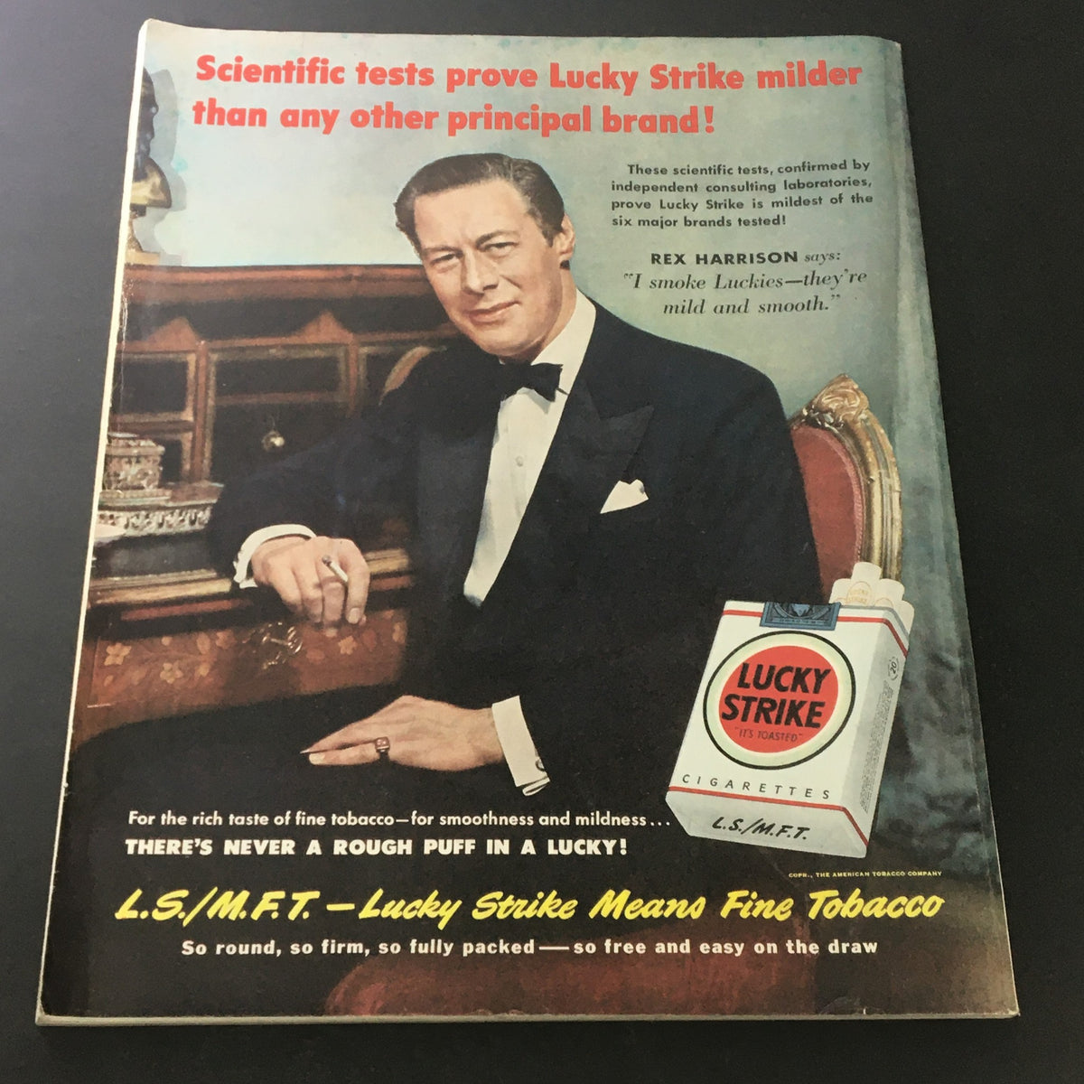 Advertisement from the July 1950 VTG Journal Magazine for Lucky Strike cigarettes, featuring a well-dressed man endorsing the brand.
