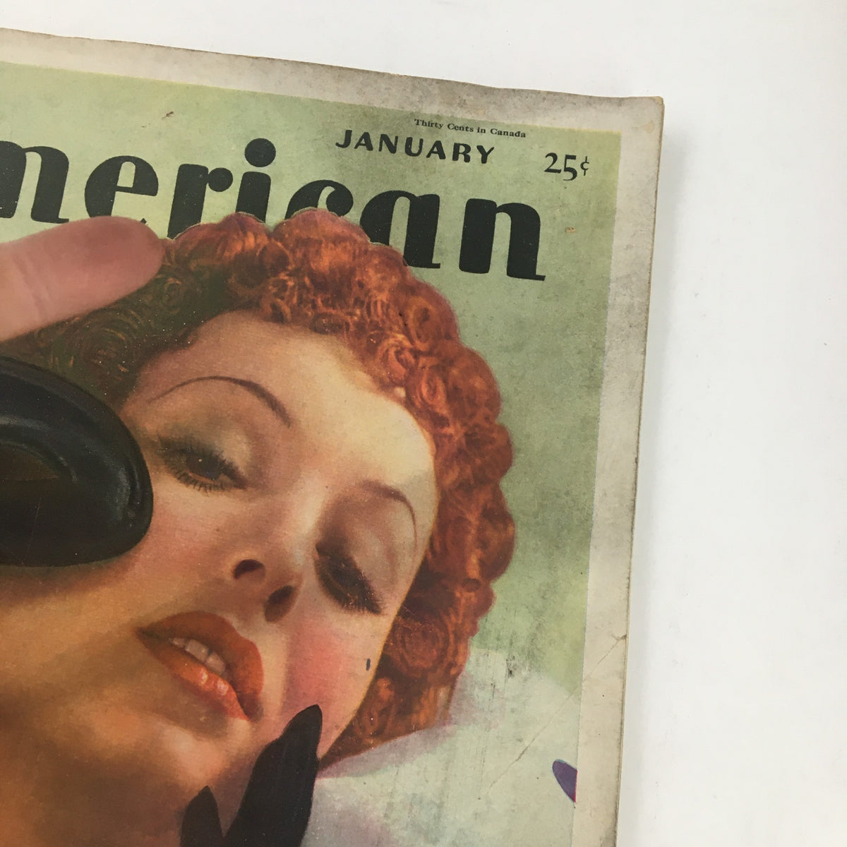Close-up of The American Magazine, January 1936, emphasizing the intricate details of the cover featuring 'The Silent Staircase' mystery novel, with a glamorous depiction of a red-haired woman.
