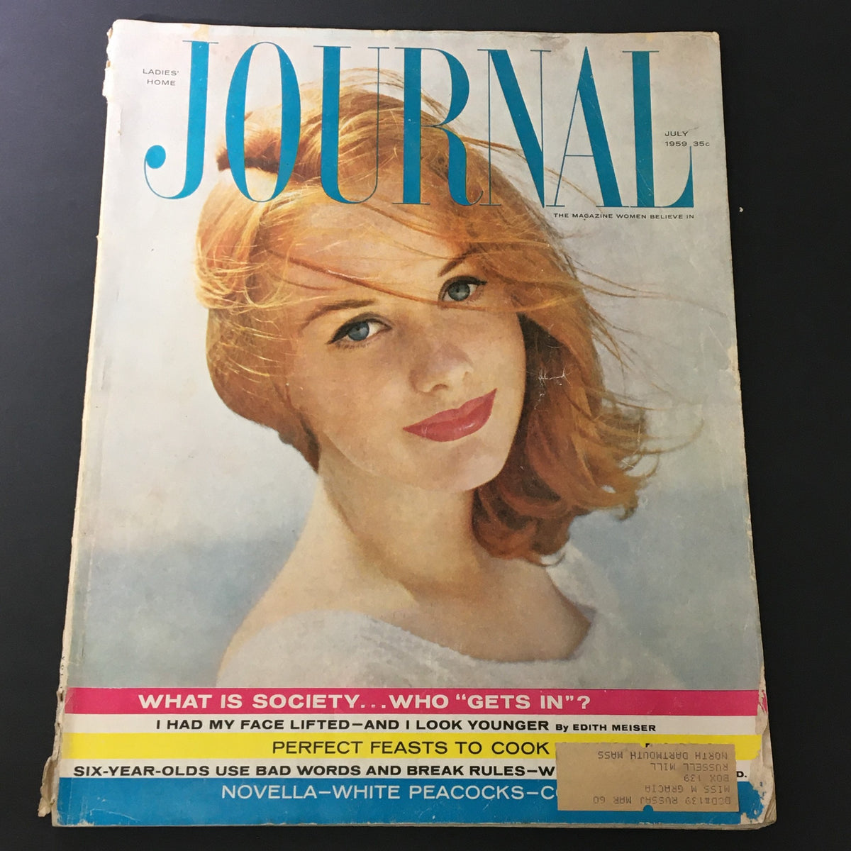 Cover of VTG Journal Magazine July 1959 Vol 76 #7 featuring a woman with red hair and blue typography, showcasing white peacocks and candy floss.