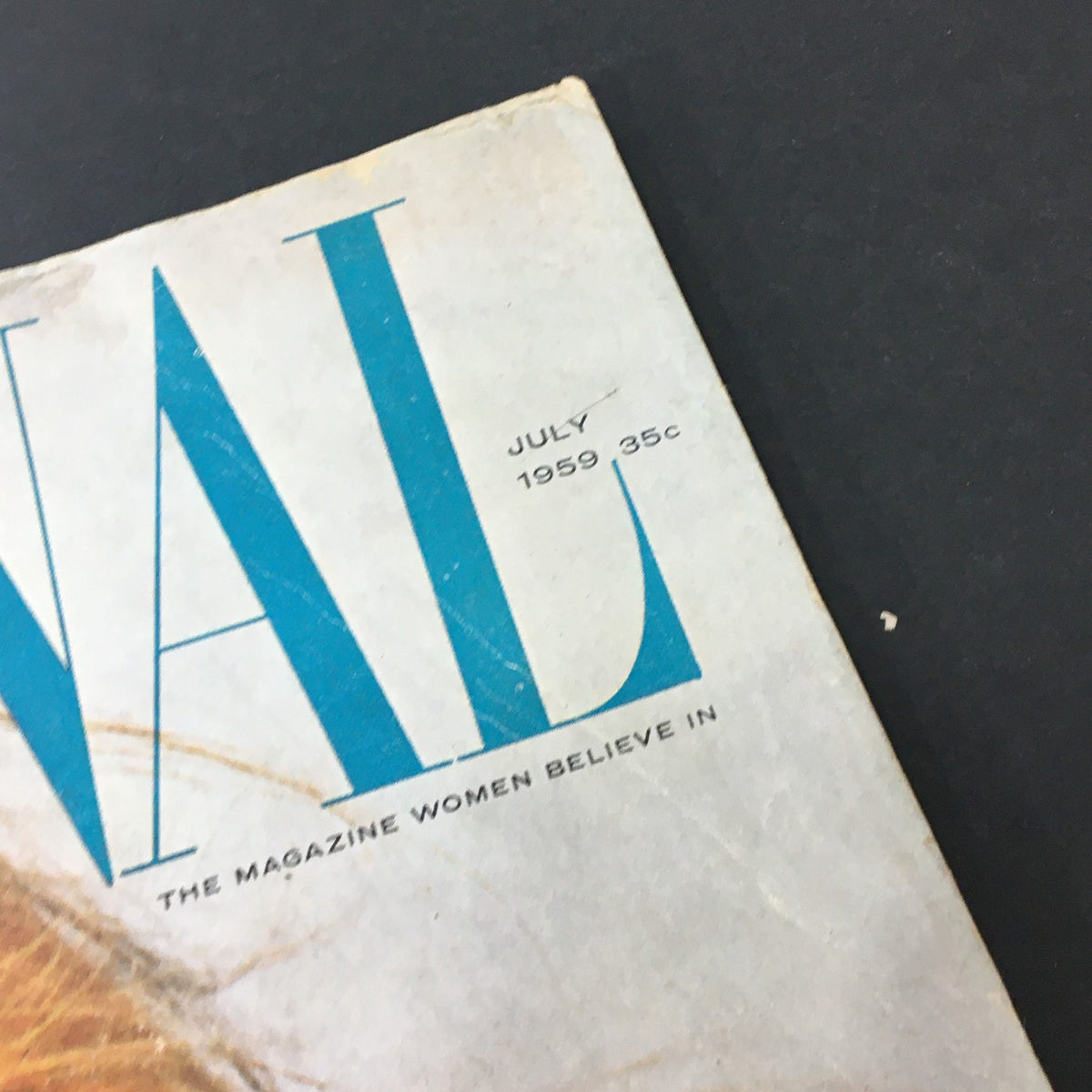 Close-up of the top corner of VTG Journal Magazine July 1959 showing the issue date and price, highlighting the vintage charm.