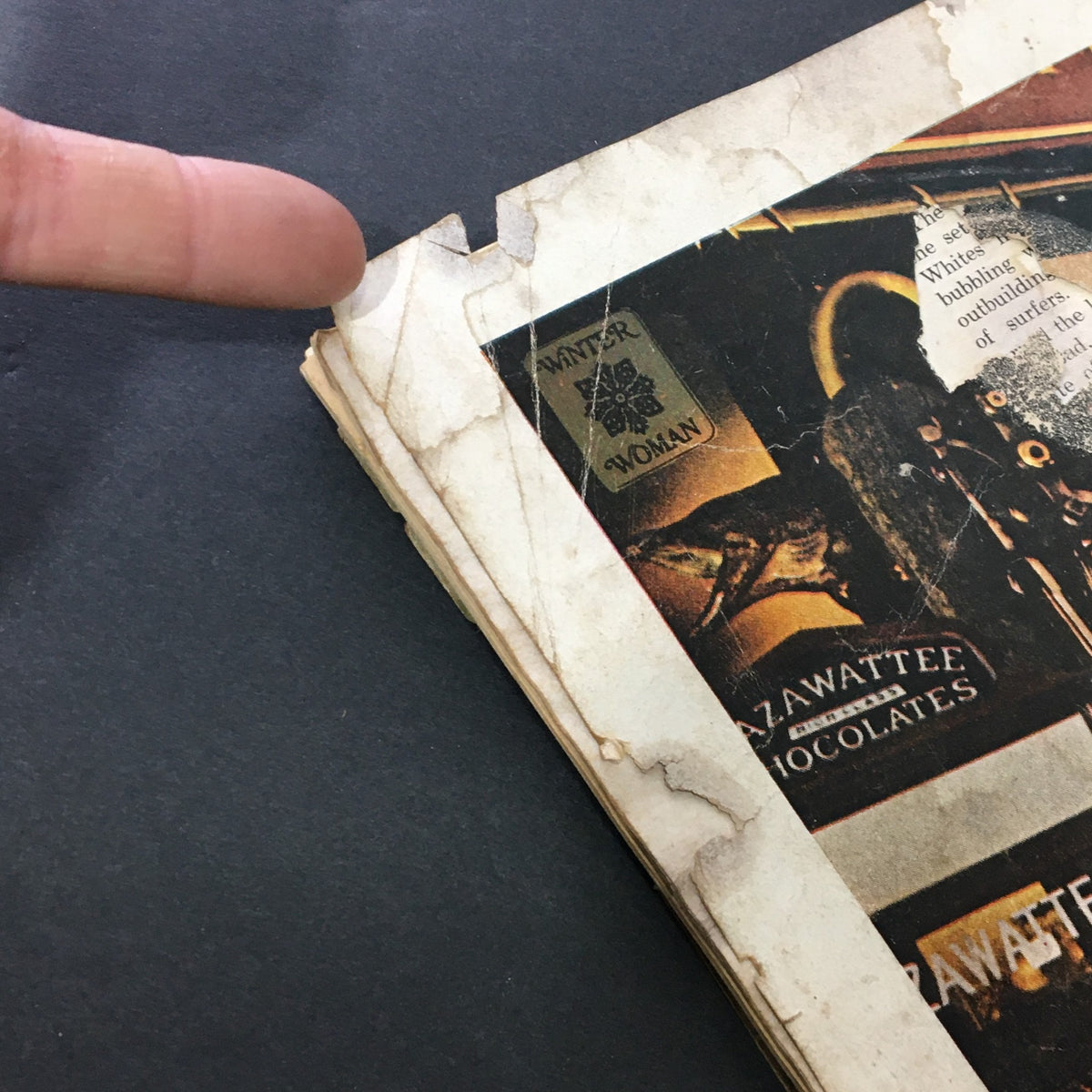 Detail of the edge of the cover of VG Journal Magazine January 1971 showing wear and tear, highlighting the vintage condition of the publication.