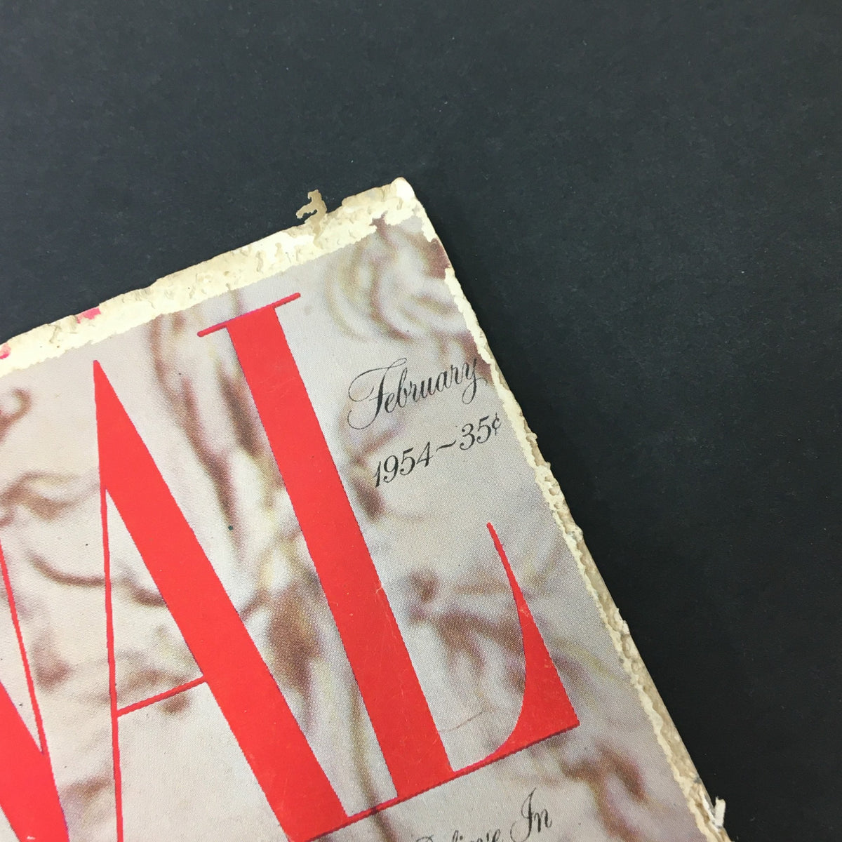 Corner detail of the VTG Journal Magazine February 1954 highlighting the publication date and price, emphasizing its vintage appeal.