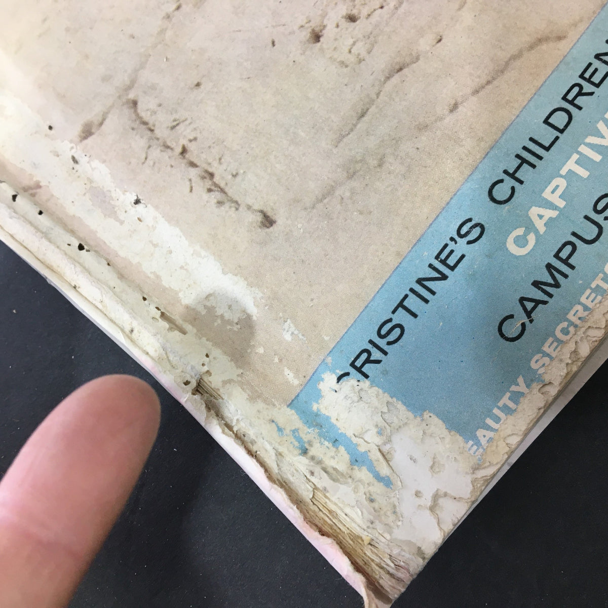 Close-up of the edge of the vintage July 1957 VTG Journal Magazine featuring visible wear and tear.