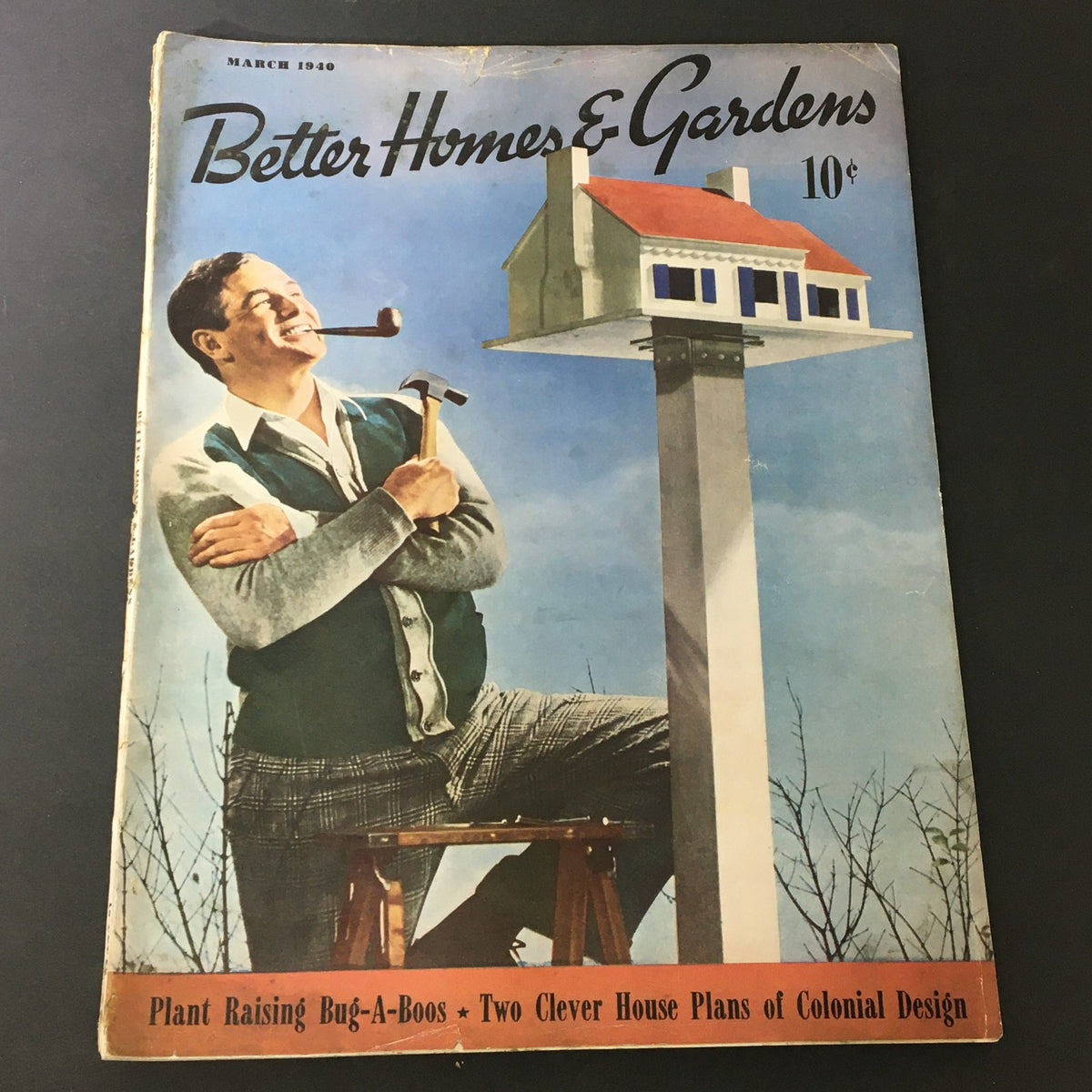 Vintage Better Homes & Gardens March 1940 magazine cover featuring a man with a pipe and hammer, showcasing home and garden themes.