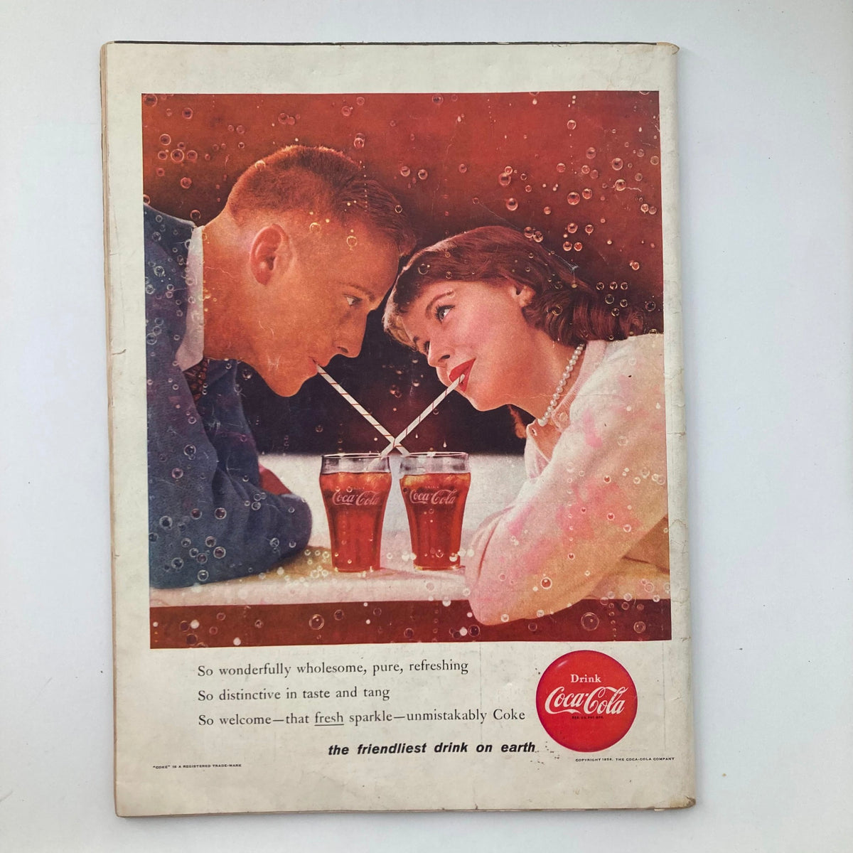 Back cover of VTG Life Magazine January 30 1956 displaying a vintage advertisement for Coca-Cola featuring a couple sharing drinks.