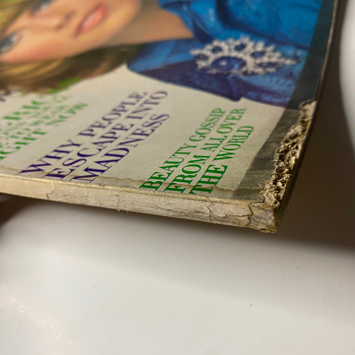 Close-up of the corner of Vogue Magazine September 15, 1969 - Susanne Schöneborn Cover, highlighting wear and tear with text mentioning beauty gossip.
