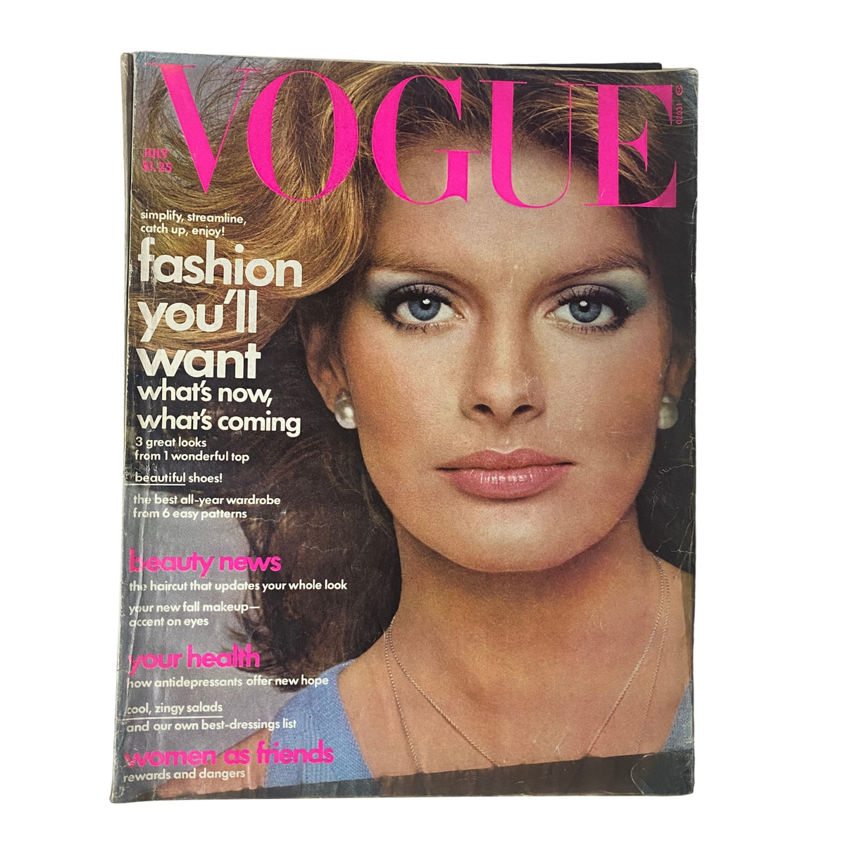 Vintage Vogue Magazine July 1975 featuring a striking cover portrait of Rene Russo, photographed by Francesco Scavullo, highlighting fashion trends and beauty insights of the 1970s.