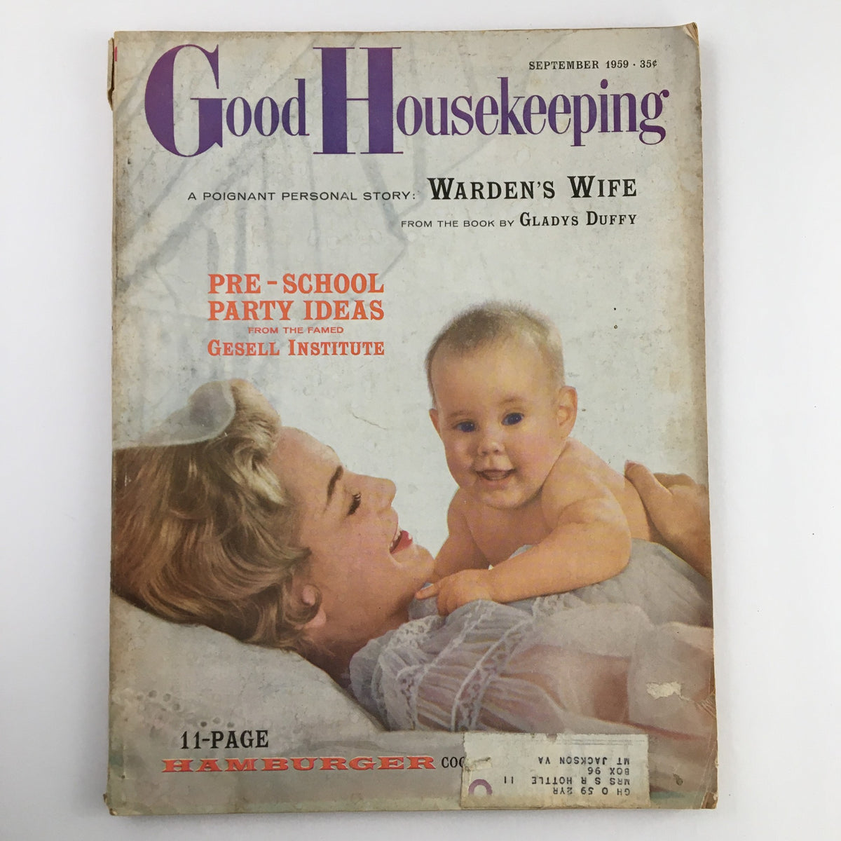 Cover of Good Housekeeping Magazine from September 1959 featuring the Warden's Wife book by Gladys Duff, showcasing a mother and baby.