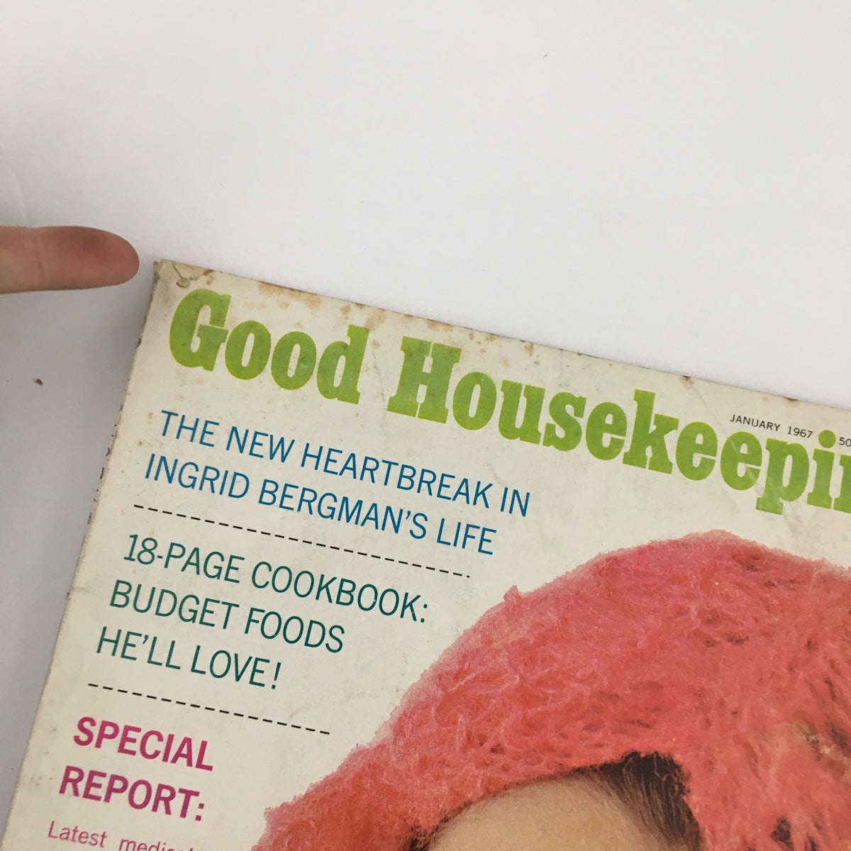 Close-up of the cover of Good Housekeeping Magazine January 1967 showcasing the article title 'The New Heartbreak in Ingrid Bergman's Life' alongside a pink headpiece worn by a model.