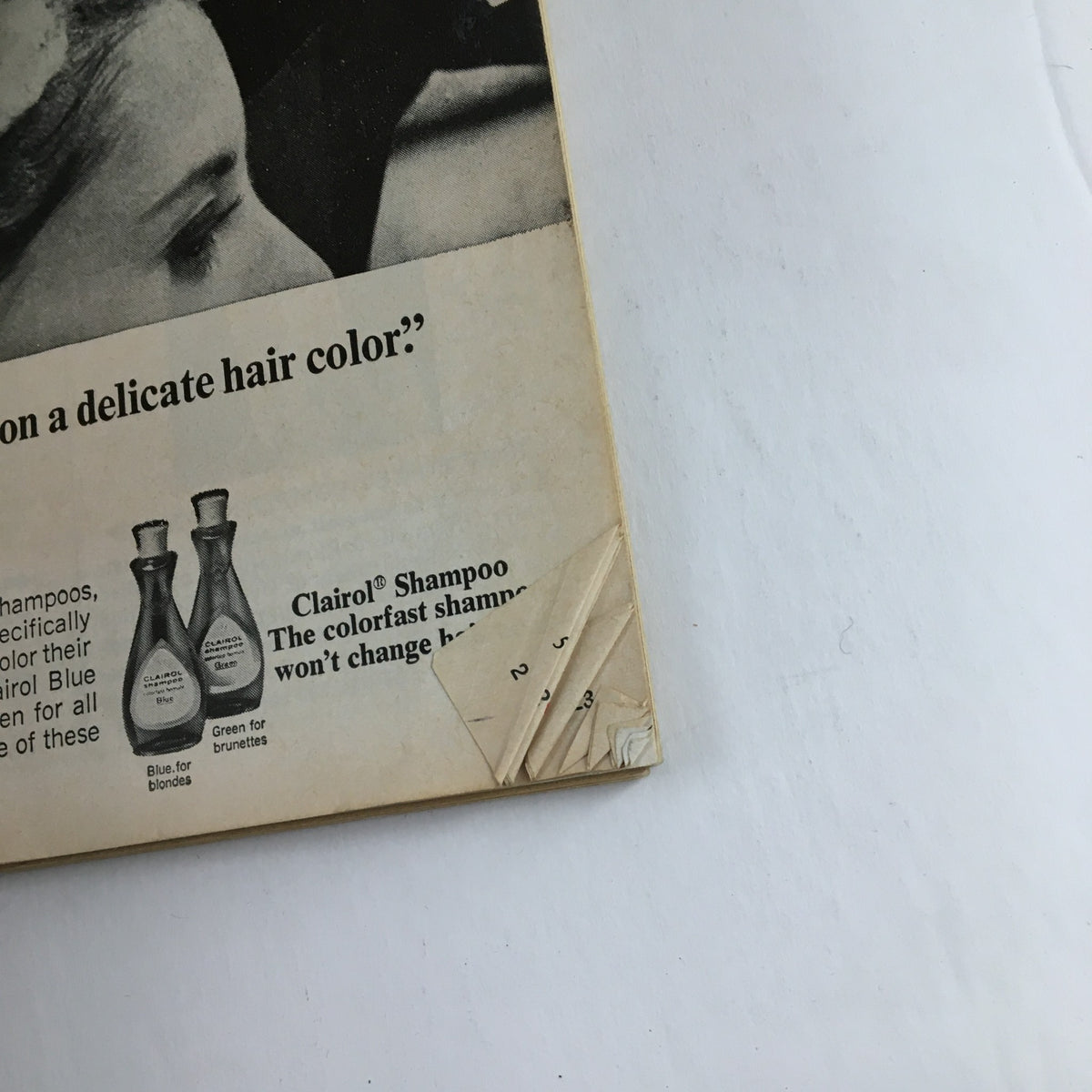 Back cover of Good Housekeeping Magazine January 1967, featuring a vintage Clairol shampoo advertisement and signs of wear, enhancing its nostalgic value.