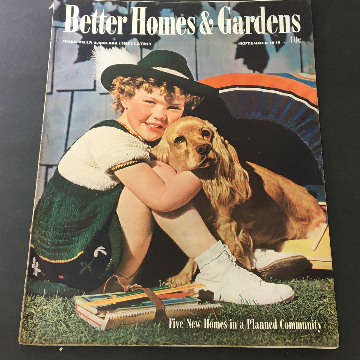 Cover of VTG Better Homes & Gardens September 1940 Indoor and Outdoor Gardening Guide featuring a smiling girl in a hat with a golden retriever dog, surrounded by gardening supplies.