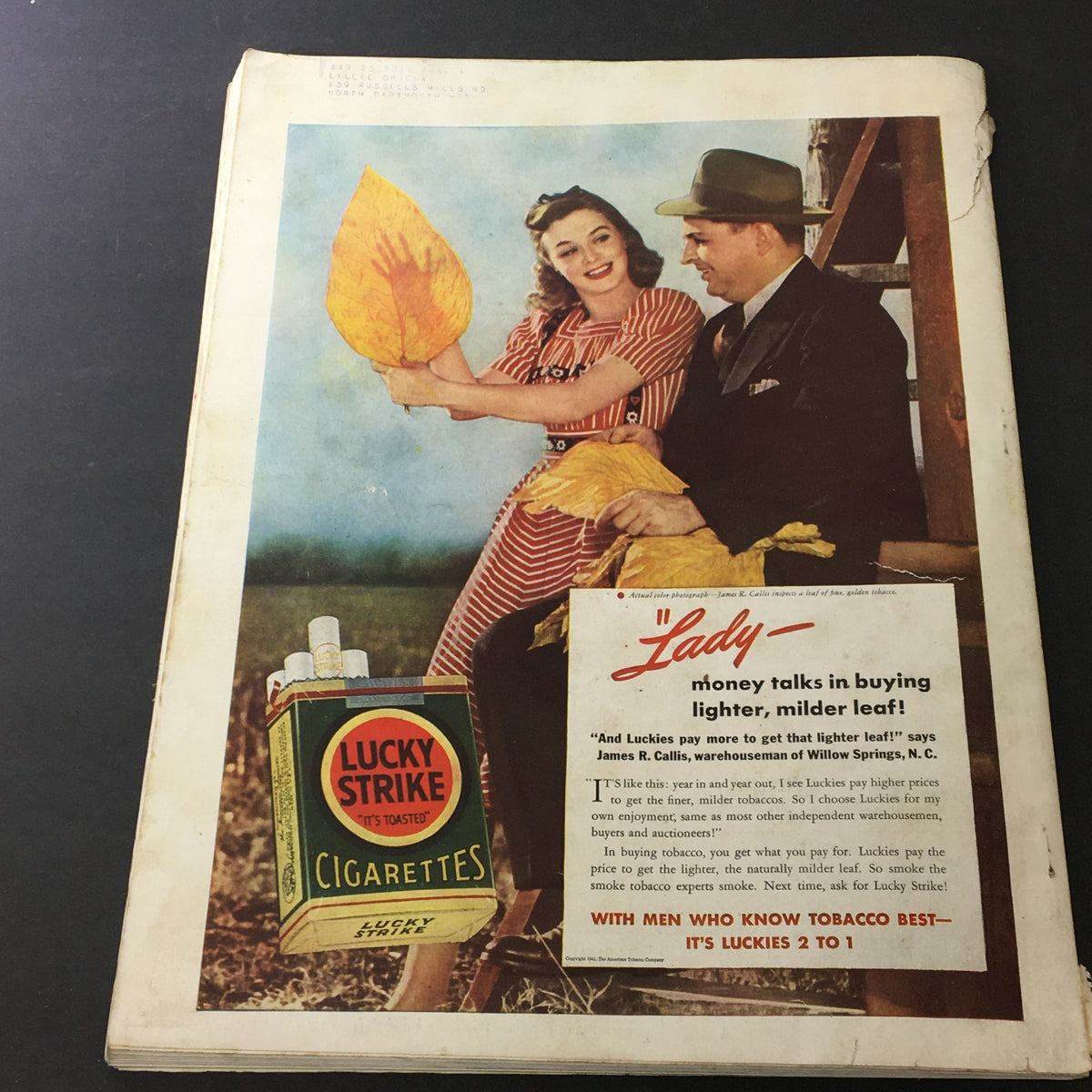 VTG Better Homes & Gardens May 1941 Extra Sparkle For Your Summer Meals - A vintage advertisement featuring a couple with large yellow leaves and a Lucky Strike cigarette pack on the ground.