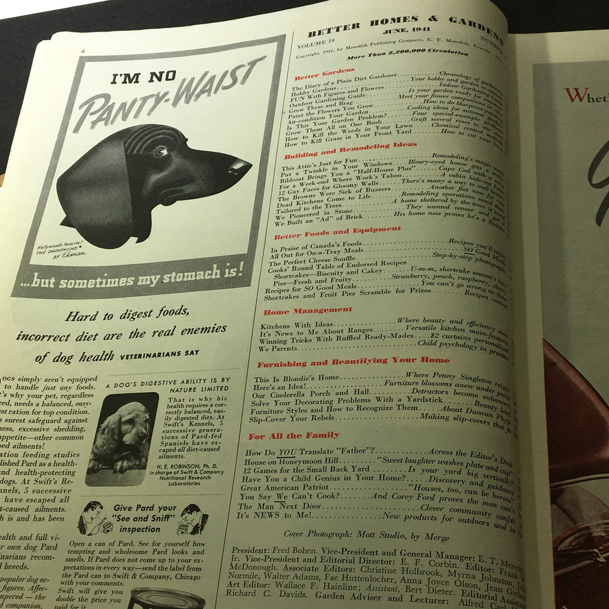 Inside page of Better Homes & Gardens June 1941 magazine displaying advertisements and contents related to gardening and home management, featuring a playful dog illustration.
