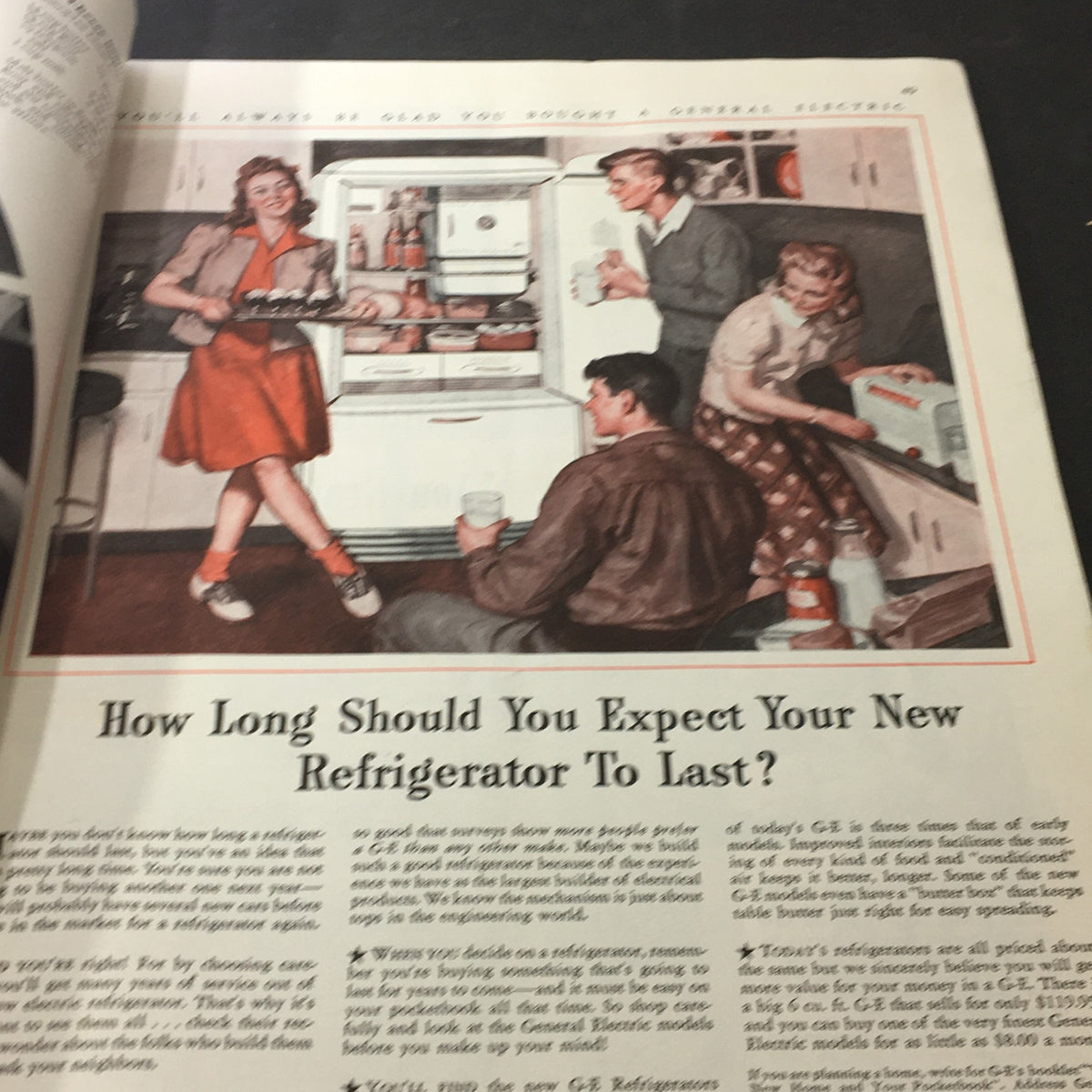 Illustration of individuals around a refrigerator promoting a General Electric appliance, from VTG Better Homes & Gardens June 1941 Dead Kitchen Comes To Life.