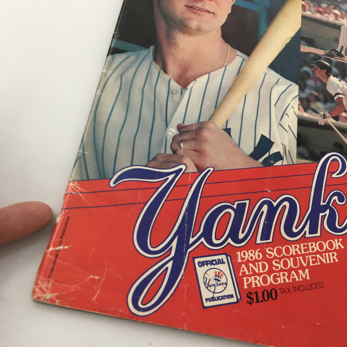 Detailed view of the 1986 Official Scorebook & Souvenir Program for MLB New York Yankees featuring Don Mattingly, showcasing the iconic Yankees logo.