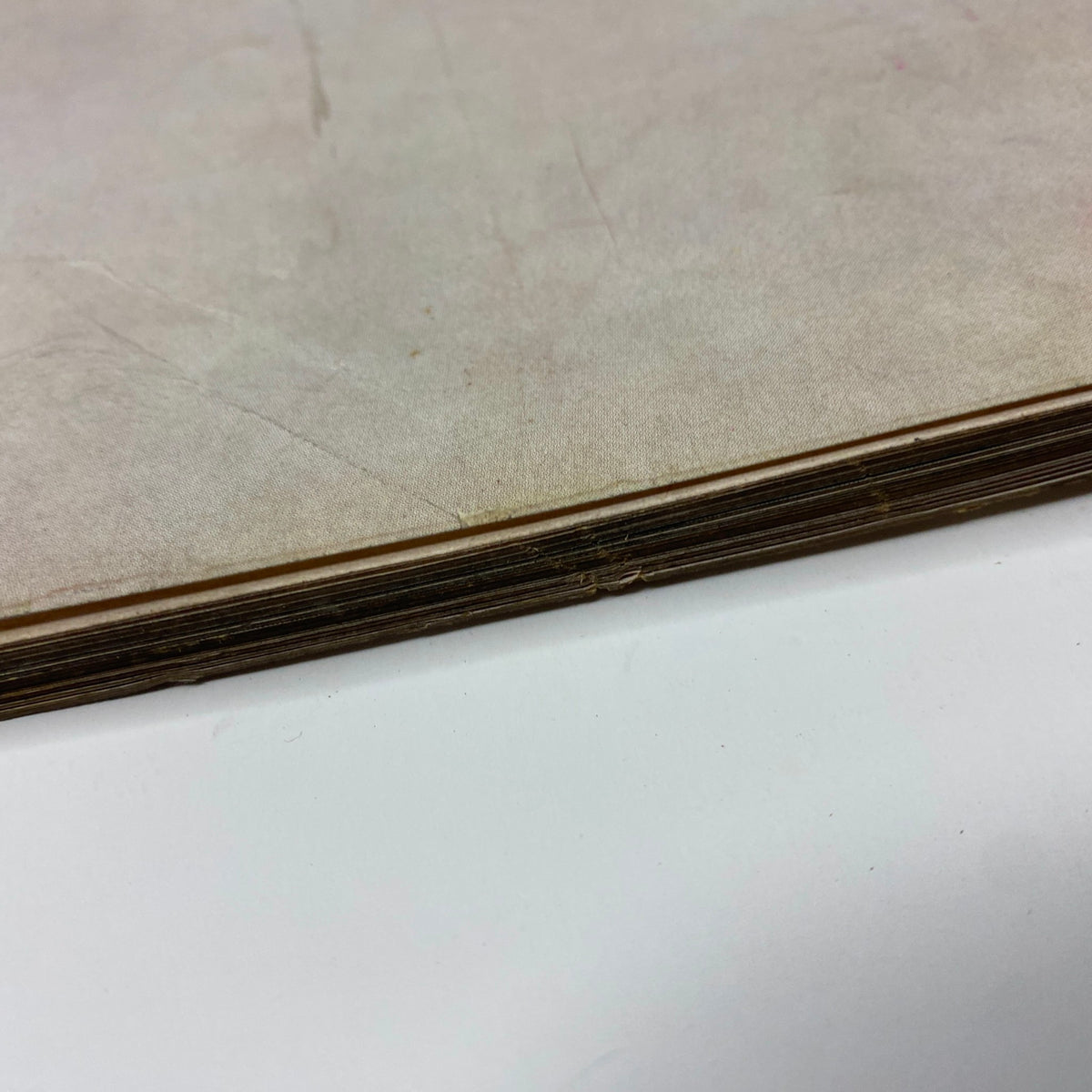 Page detail of vintage Harper's Bazaar Magazine May 1962, showcasing wear on the spine, indicating age yet maintaining importance for collectors.