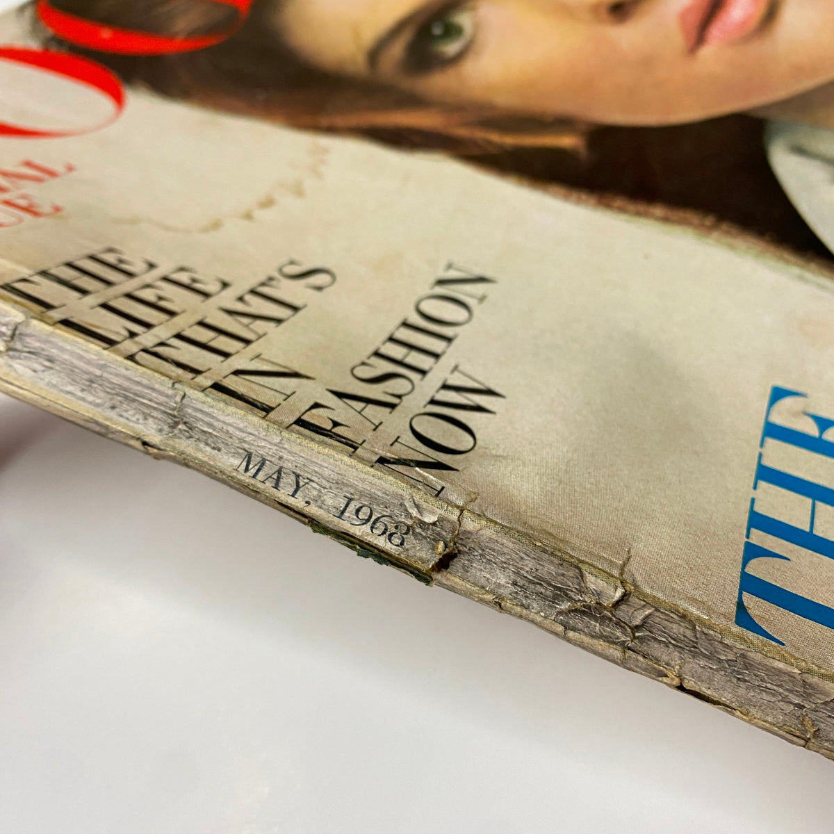 Side view of Vogue Magazine May 1968 revealing the date and additional cover text, illustrating signs of wear and age.