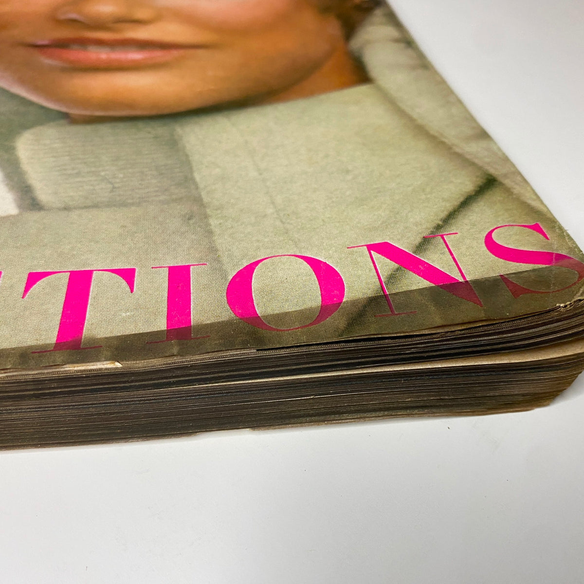 Close-up view of the edge of Vogue Magazine September 1, 1969, highlighting the vintage condition of the magazine, including its worn spine and characteristic patina from age.