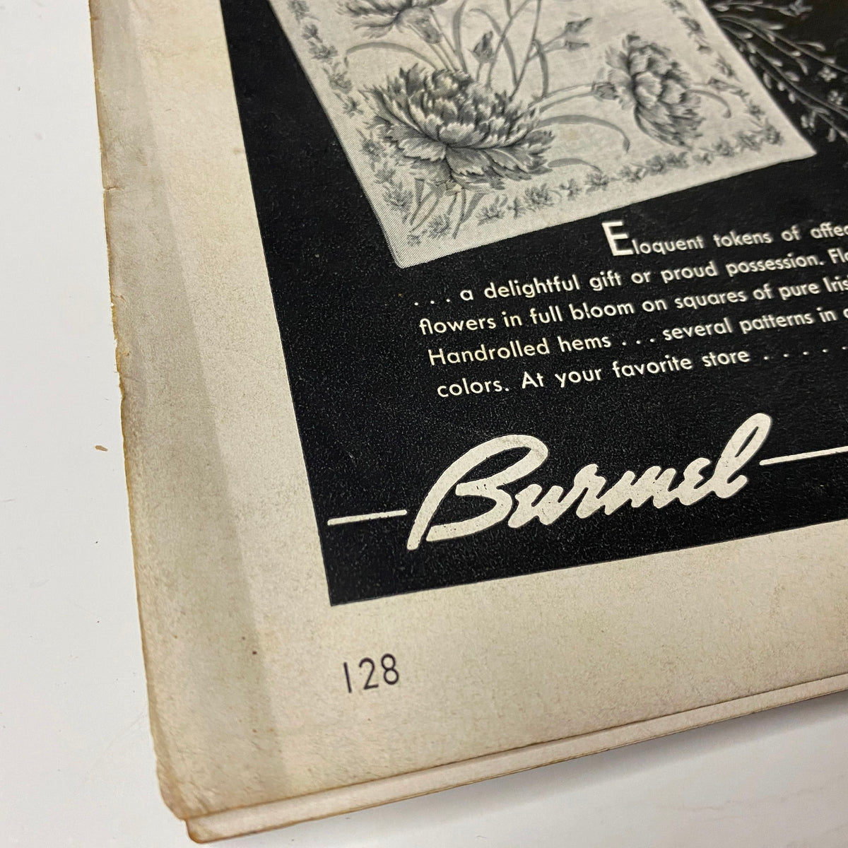 Cover page detail from Vogue Magazine May 1, 1942 featuring advertising for Burmel, highlighting elegant floral designs in a vintage magazine context.