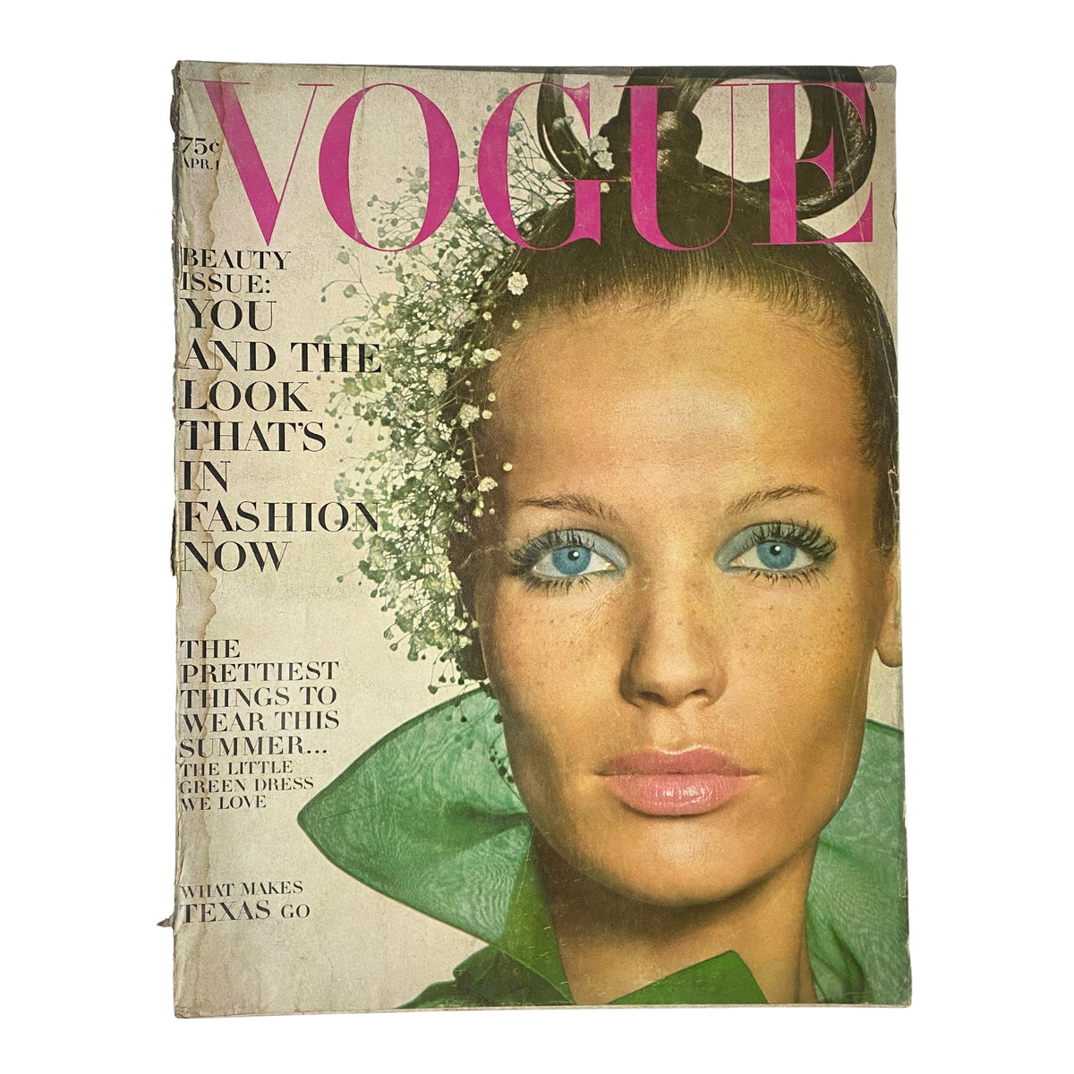 Vogue Magazine April 1, 1968 — Veruschka Cover by Irving Penn displaying a model with bold blue eyes and floral accents, highlighting mid-century fashion.