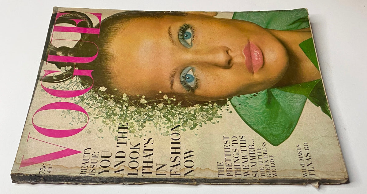 Vogue Magazine April 1, 1968 Veruschka Cover by Irving Penn showcasing a vintage fashion aesthetic with striking blue eye makeup and floral headpiece.