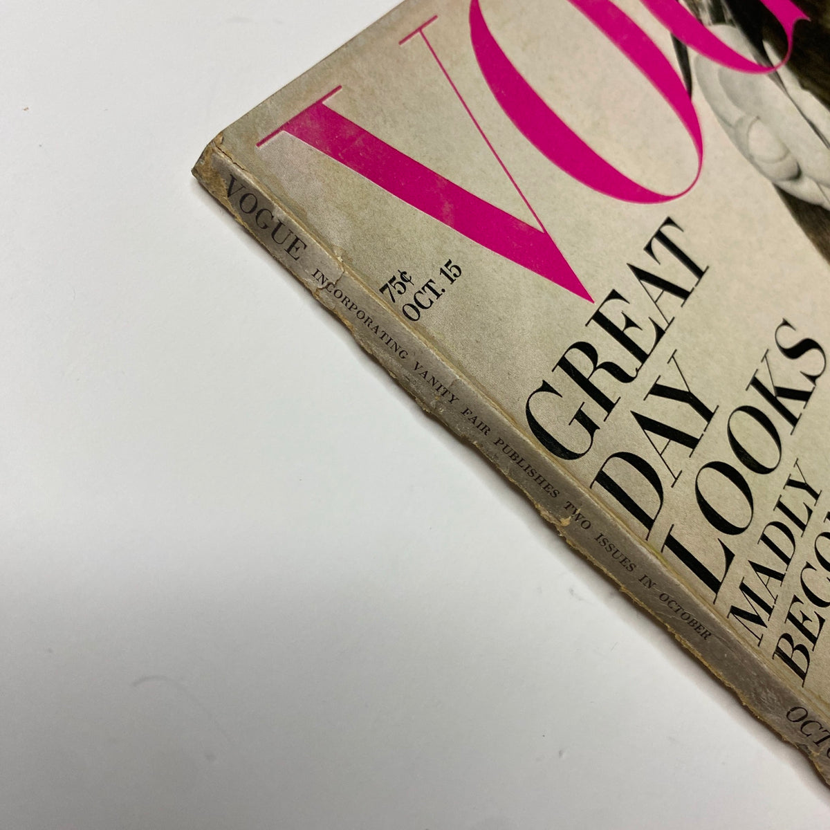 Close-up of the spine and date on the vintage Vogue Magazine, October 15, 1967, emphasizing its collectible condition.