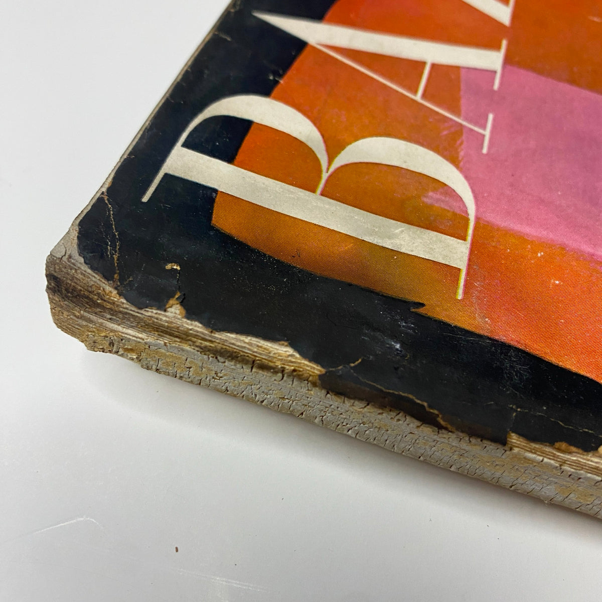 Detail of the spine of Harper's Bazaar Magazine September 1955, illustrating wear and age while featuring the iconic cover design focused on The American Openings and The Paris Openings.