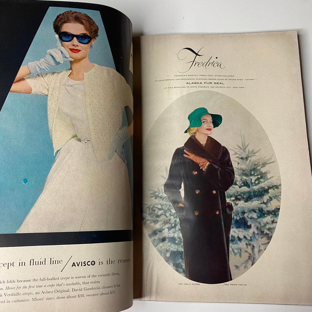 Harper's Bazaar Magazine December 1955 showcasing a glamorous winter fashion look with model in a fur coat and stylish accessories.