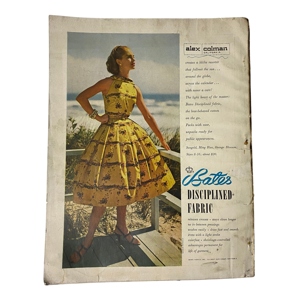 Harper's Bazaar Magazine December 1955 displaying a vintage model dressed in a floral yellow dress, emphasizing mid-century fashion aesthetics.