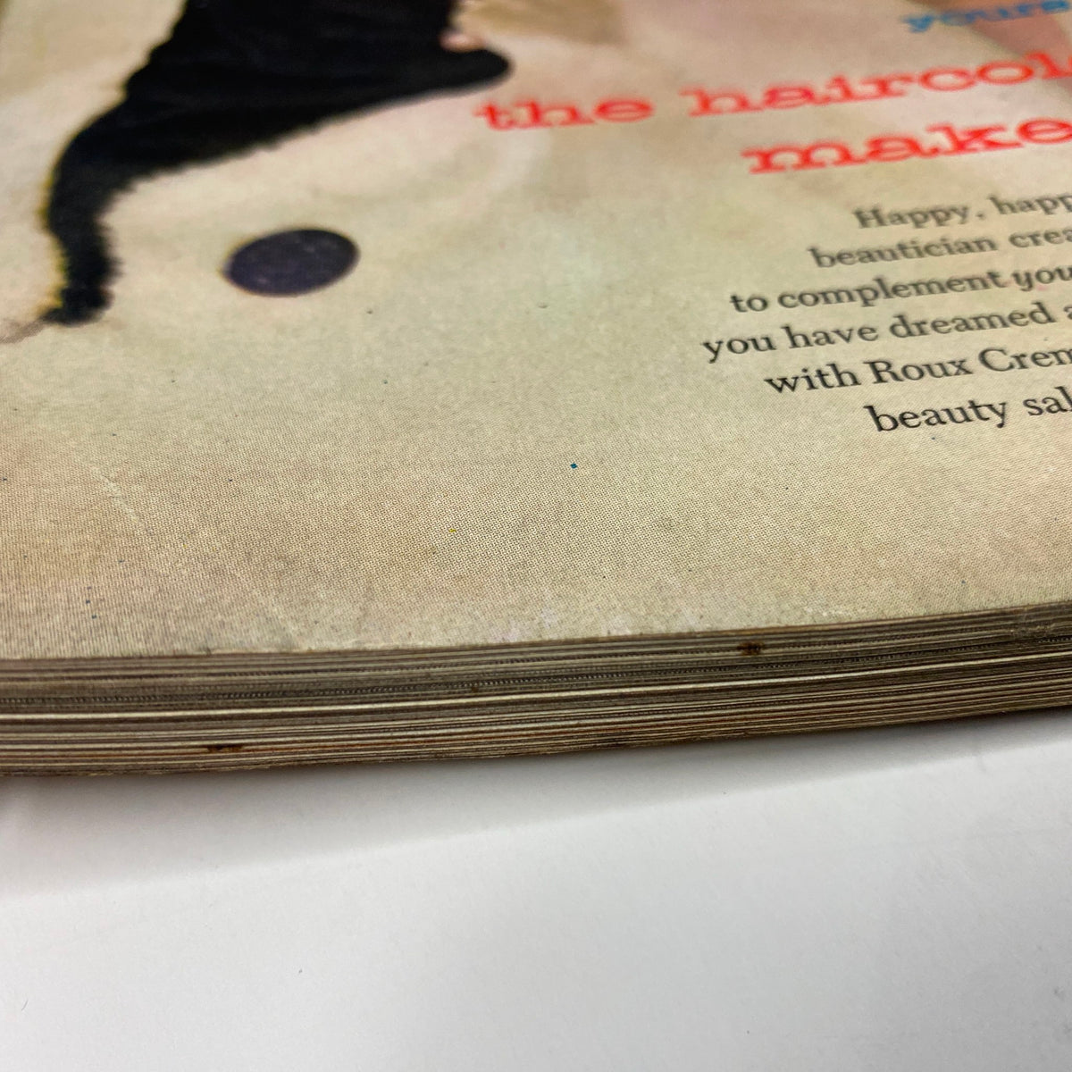 Detail of the spine of Harper's Bazaar Magazine April 1955, showing wear and age, showcasing the vintage aesthetic of this issue with Liz Pringle on the cover by Richard Avedon.