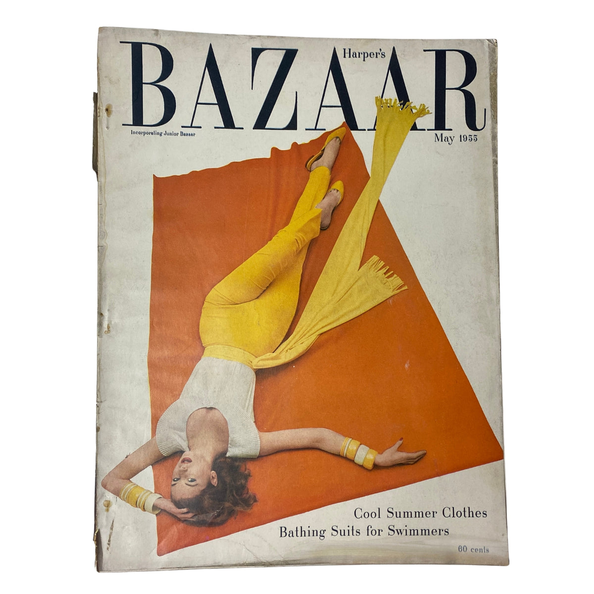Harper's Bazaar Magazine May 1955 featuring a model in yellow pants and white top on the cover, styled by Richard Avedon, showcasing summer fashion and bathing suits.