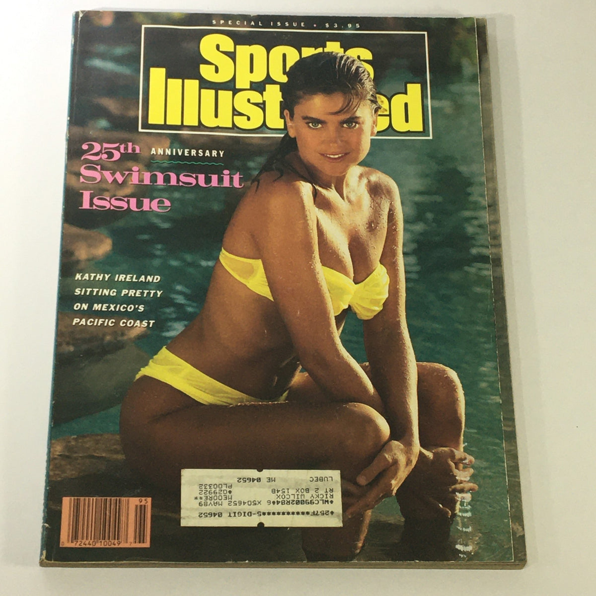 Vintage Sports Illustrated 1989 Swimsuits Issue featuring Kathy Ireland in a yellow bikini, showcasing beach glamour and 1980s fashion.