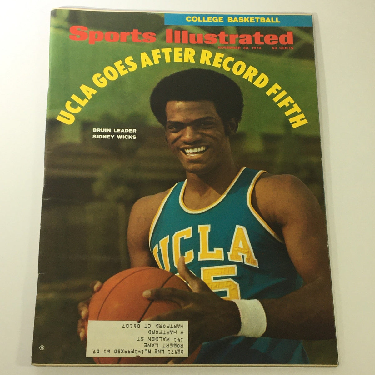 Vintage Sports Illustrated Magazine cover from November 30, 1970, featuring Bruin leader Sidney Wicks, showcasing UCLA basketball with the headline 'UCLA Goes After Record Fifth'.