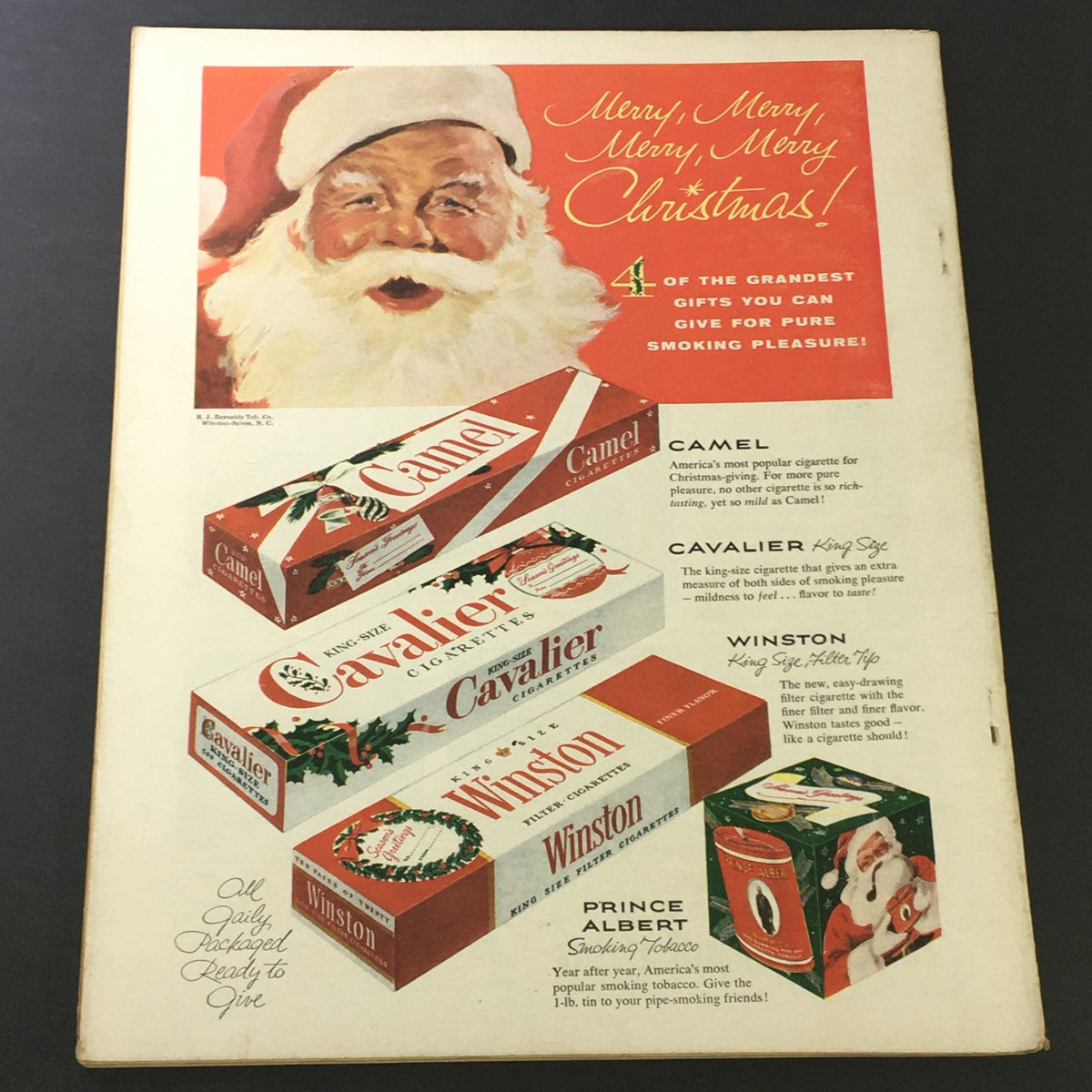 Back cover of VTG Sport Magazine January 1955 featuring a Christmas-themed advertisement for Camel, Cavalier, and Winston cigarettes, capturing vintage advertising style.