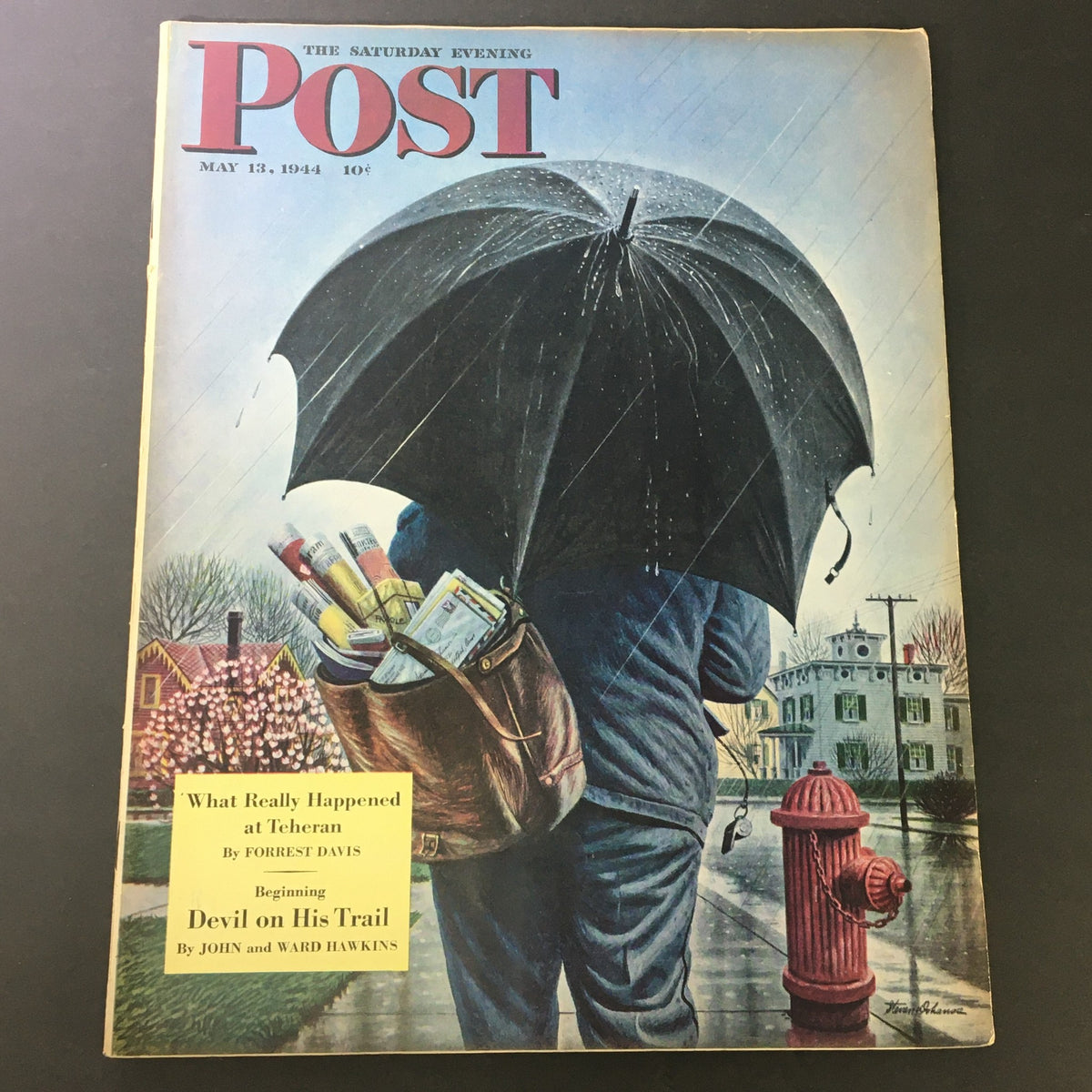 Cover of VTG The Saturday Evening Post May 13 1944 featuring an illustration of a man holding an umbrella in the rain, a bag of newspapers, and the headline for 'Devil on His Trail'.