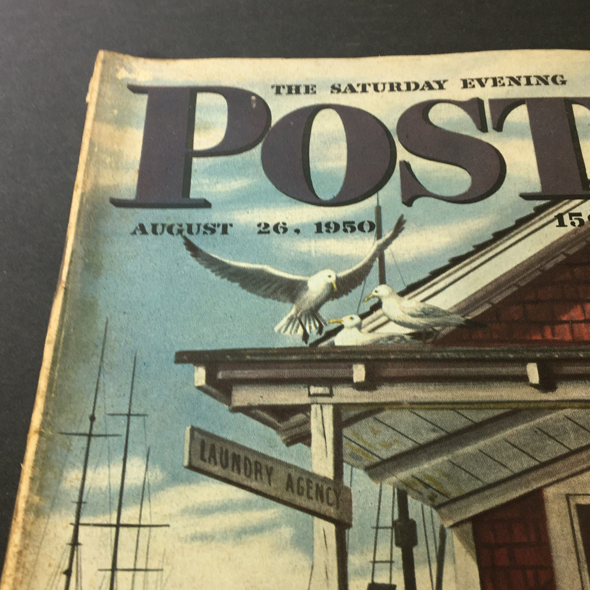 Close-up of VTG The Saturday Evening Post August 26 1950 cover showing seagulls and signage for a laundry agency.