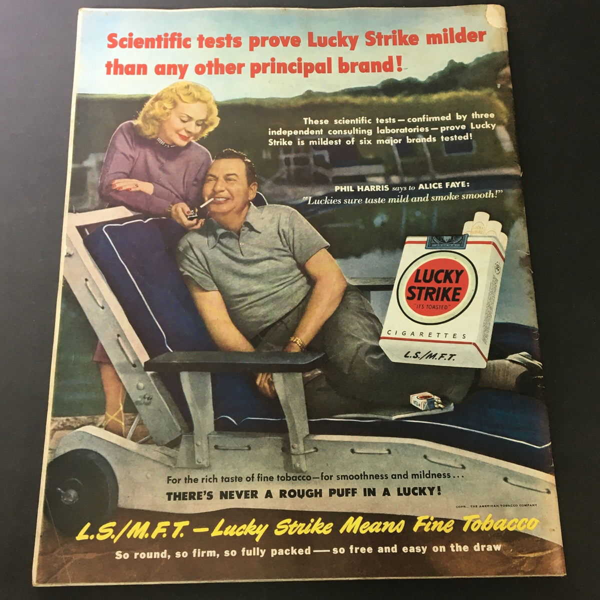 Vintage magazine cover of The Saturday Evening Post from August 26, 1950, featuring a Lucky Strike advertisement with celebrities Phil Harris and Alice Faye, promoting Lucky Strike cigarettes as the mildest brand.