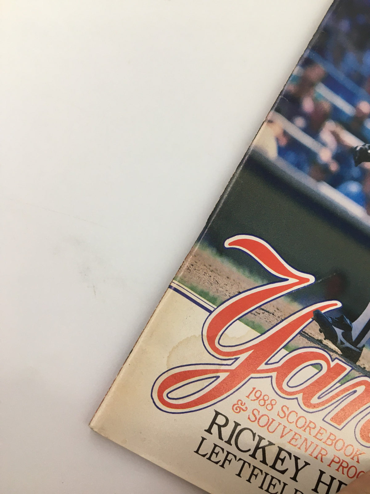Close-up view of the top edge of the 1988 New York Yankees Scorebook & Souvenir Program featuring Rickey Henderson, highlighting the vintage design elements.