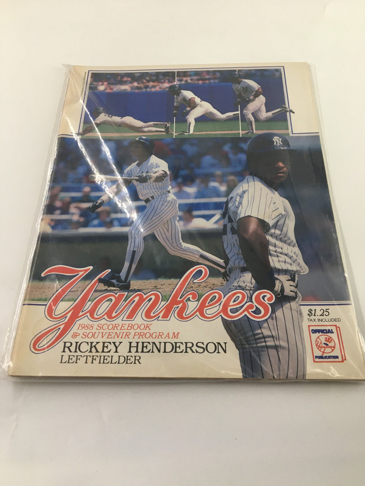 Cover of the 1988 New York Yankees Scorebook & Souvenir Program showcasing Rickey Henderson as the leftfielder, with action shots from games.