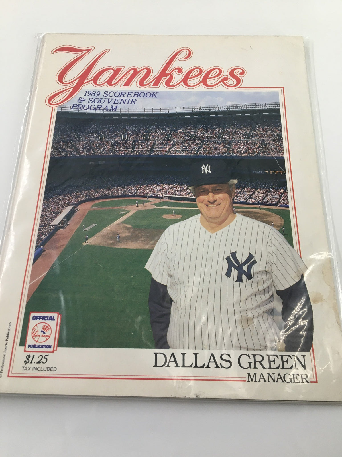 1989 New York Yankees Scorebook & Souvenir Program featuring Dallas Green, the manager, on the cover with a baseball stadium in the background.