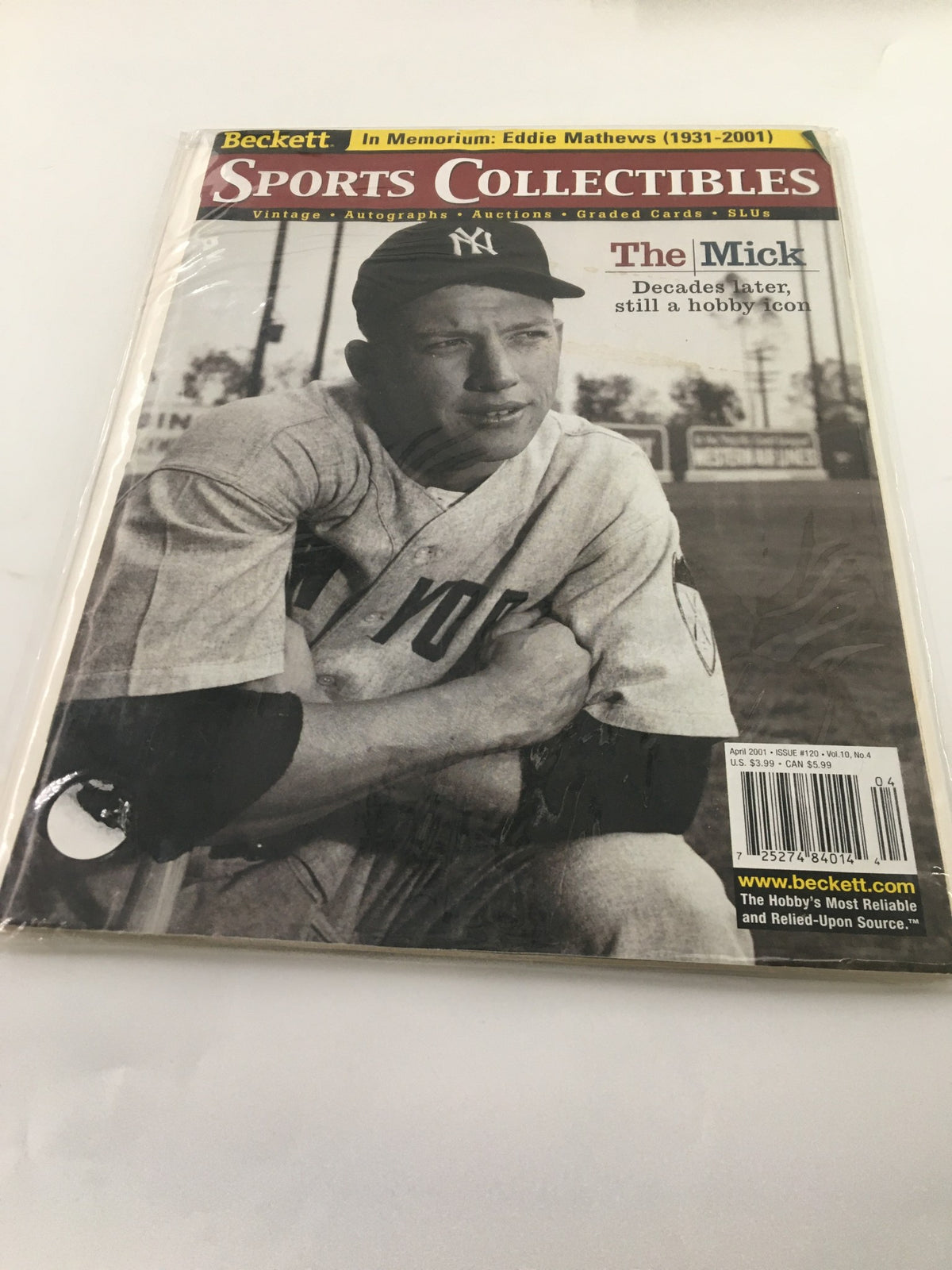 Back cover of Beckett Sports Collectibles April 2001 #120 Mickey Mantle, Ed Mathews featuring an image of Mickey Mantle and an obituary for Ed Mathews.