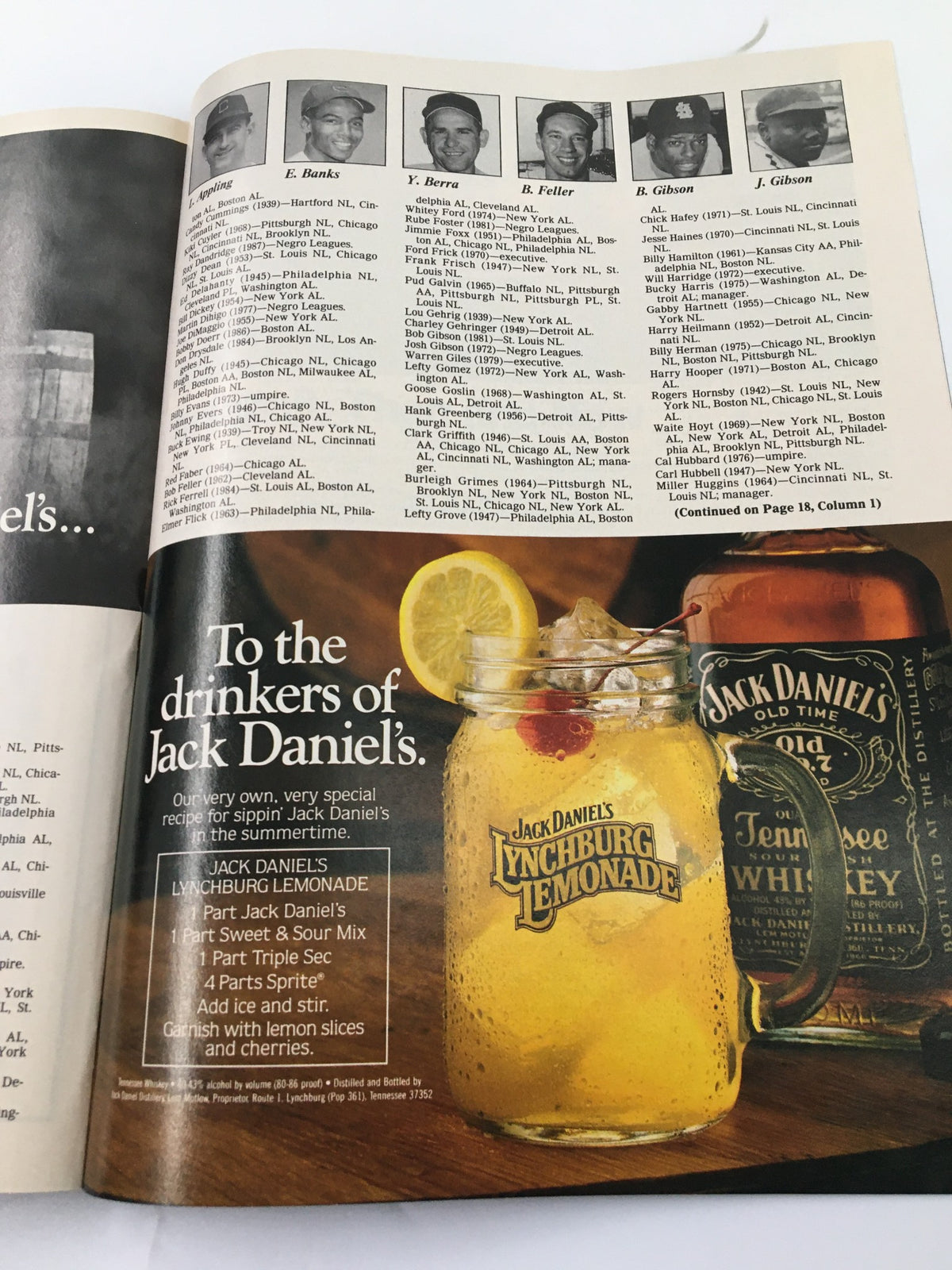 Interior page from the 1990 The Sporting News Fifty-First Annual Program featuring a vintage advertisement for Jack Daniel's Lynchburg Lemonade alongside images of baseball icons E. Banks, Y. Berra, and others.