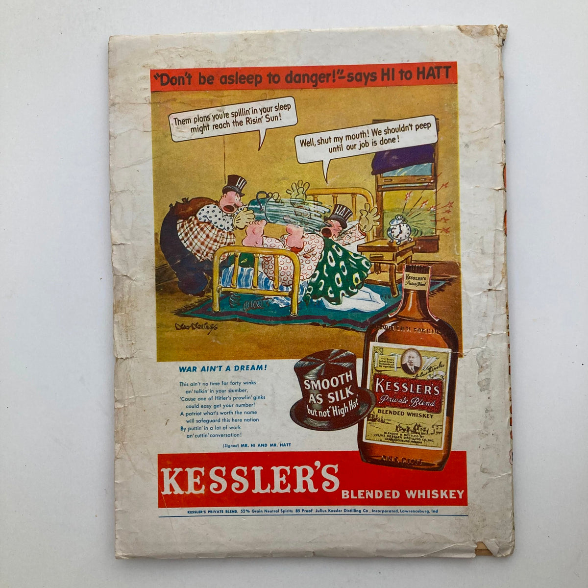 Back cover of G-8 and His Battle Aces December 1943 Vol 27 No. 3 featuring an advertisement for Kessler's Blended Whiskey with a humorous illustration.