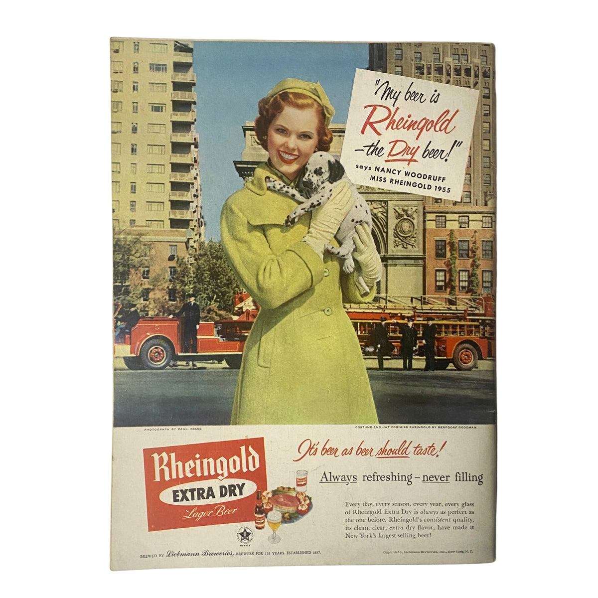 Advertisement from Gourmet Magazine March 1955 Vol 15 No. 3 featuring a woman in a yellow coat holding a dog, promoting Rheingold Extra Dry Lager Beer.