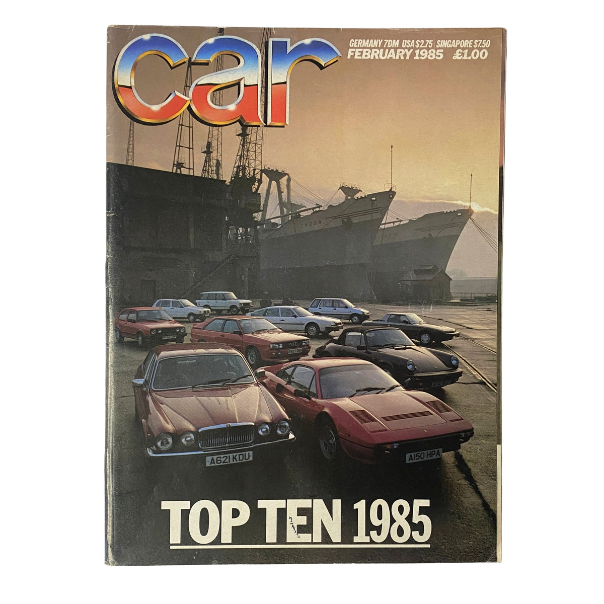 Cover of Car Magazine UK February 1985 featuring the Fiat Uno 70, Honda Civic Shuttle, and Fiat X1/9 among Top Ten Cars of 1985, showcasing various cars in front of a ship.