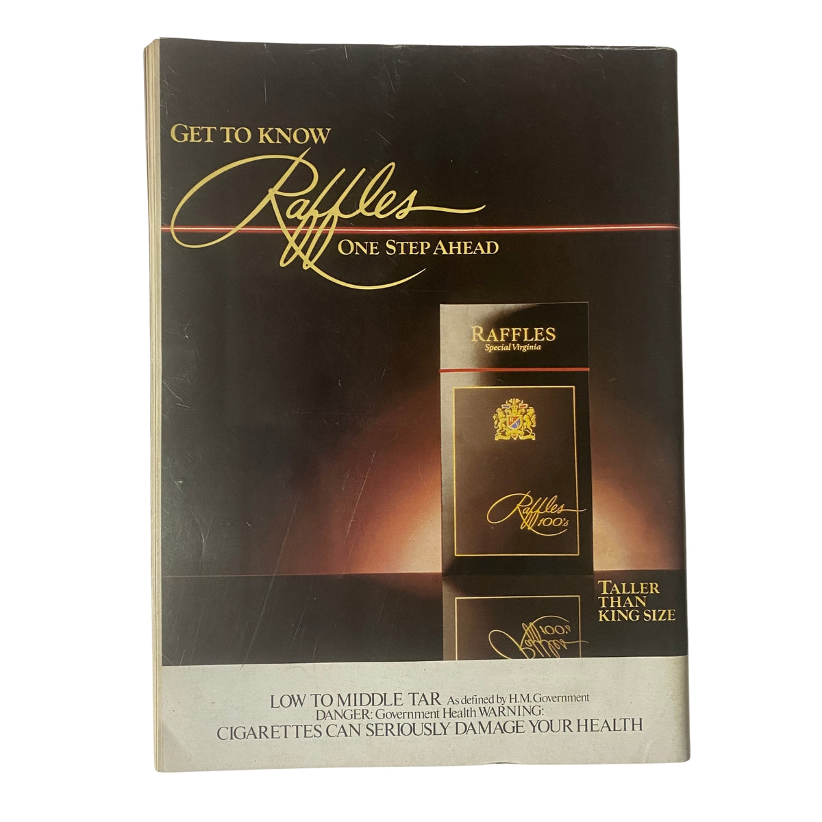 Promotional advertisement for Raffles cigarettes with a warning about health risks, indicating its low tar content and showcasing the product design, emphasizing the phrase 'Raffles One Step Ahead'.
