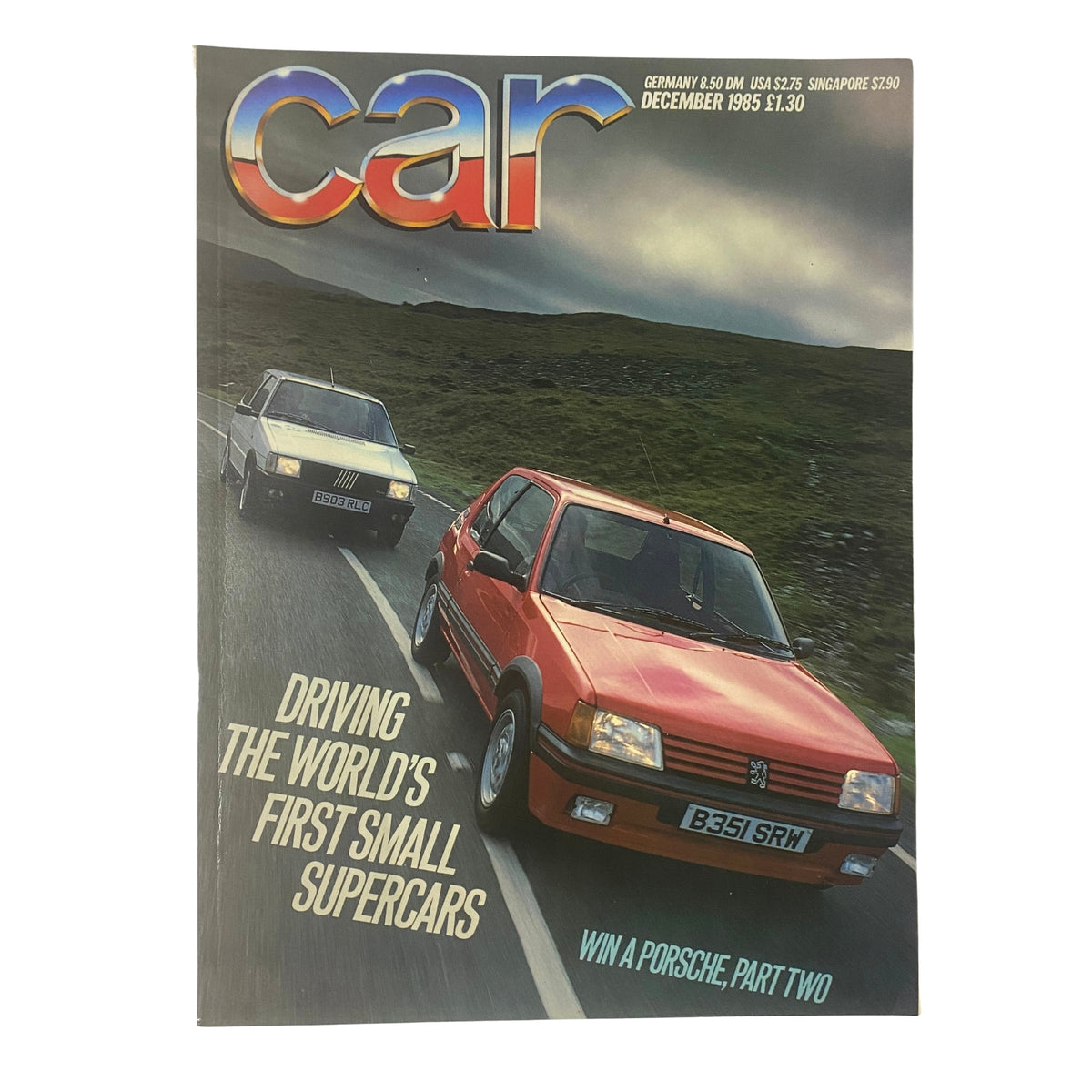 Cover of Car Magazine UK Import December 1985 featuring the title 'Driving The World's First Small Supercars' with images of iconic small supercars on a scenic road.