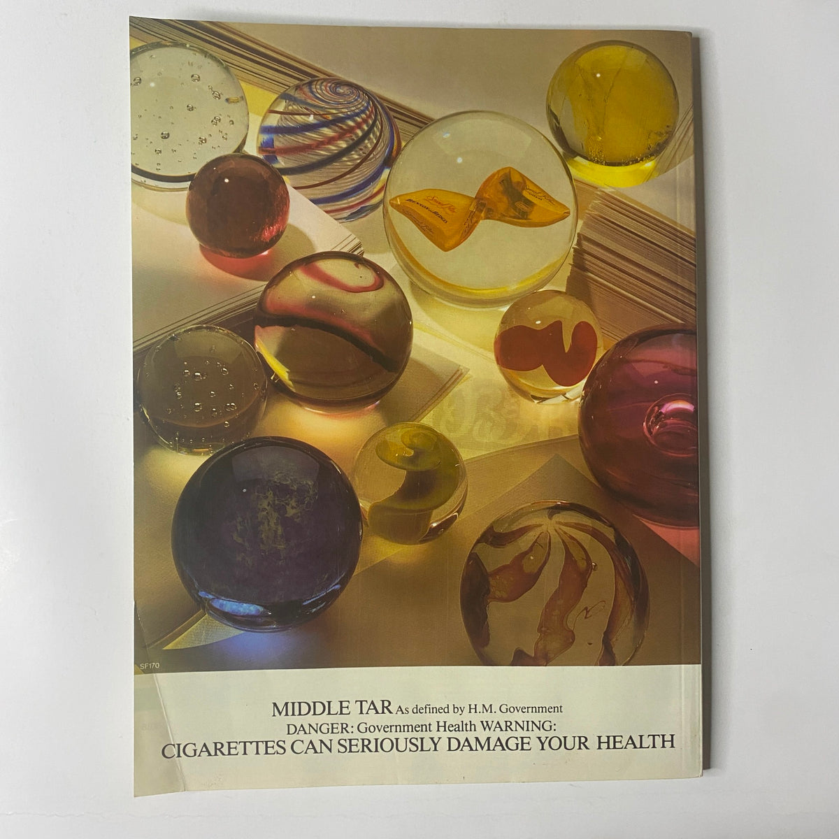 Back cover of Car Magazine UK Import December 1985 displaying a graphic warning about cigarette health risks, unrelated to the main magazine theme of small supercars.