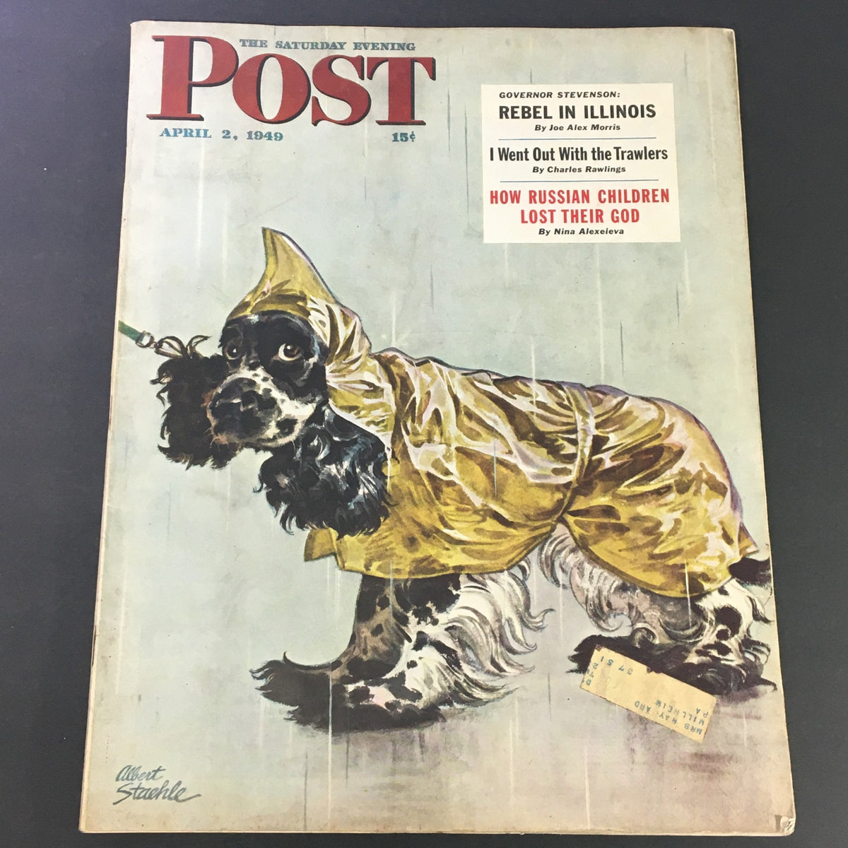Cover of the Saturday Evening Post from April 2, 1949, featuring a dog in a yellow raincoat and the title 'How Russian Children Lost Their God'.