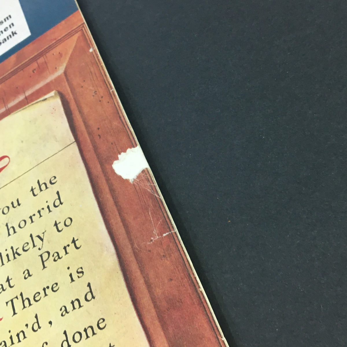 Close-up of the edge of The Saturday Evening Post January 14 1950 magazine, showing minor wear and an address label, reflecting its vintage condition.